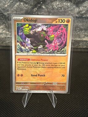Pokemon Okidogi Pokeball 057/131 Holo from‎ Prismatic Evolutions M/NM